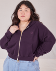 Ashley is wearing a zipped up Cropped Zip Hoodie in Nebula Purple