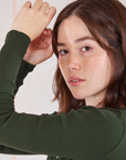 Wrap Top in Swamp Green sleeve close up on Hana