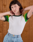 Alex is wearing Calypso Tee in Forest