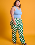 Angled front view of Checkerboard Work Pants in White/Green and baby blue Tank Top on Ashley