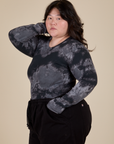 Angled front view of Long Sleeve Baby Tee in Black Magic Waters on Ashley