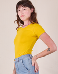 Baby Tee in Golden Yellow side view on Alex