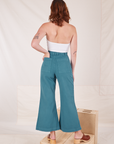 Back view of Bell Bottoms in Marine Blue and Halter Top in vintage tee off-white on Alex