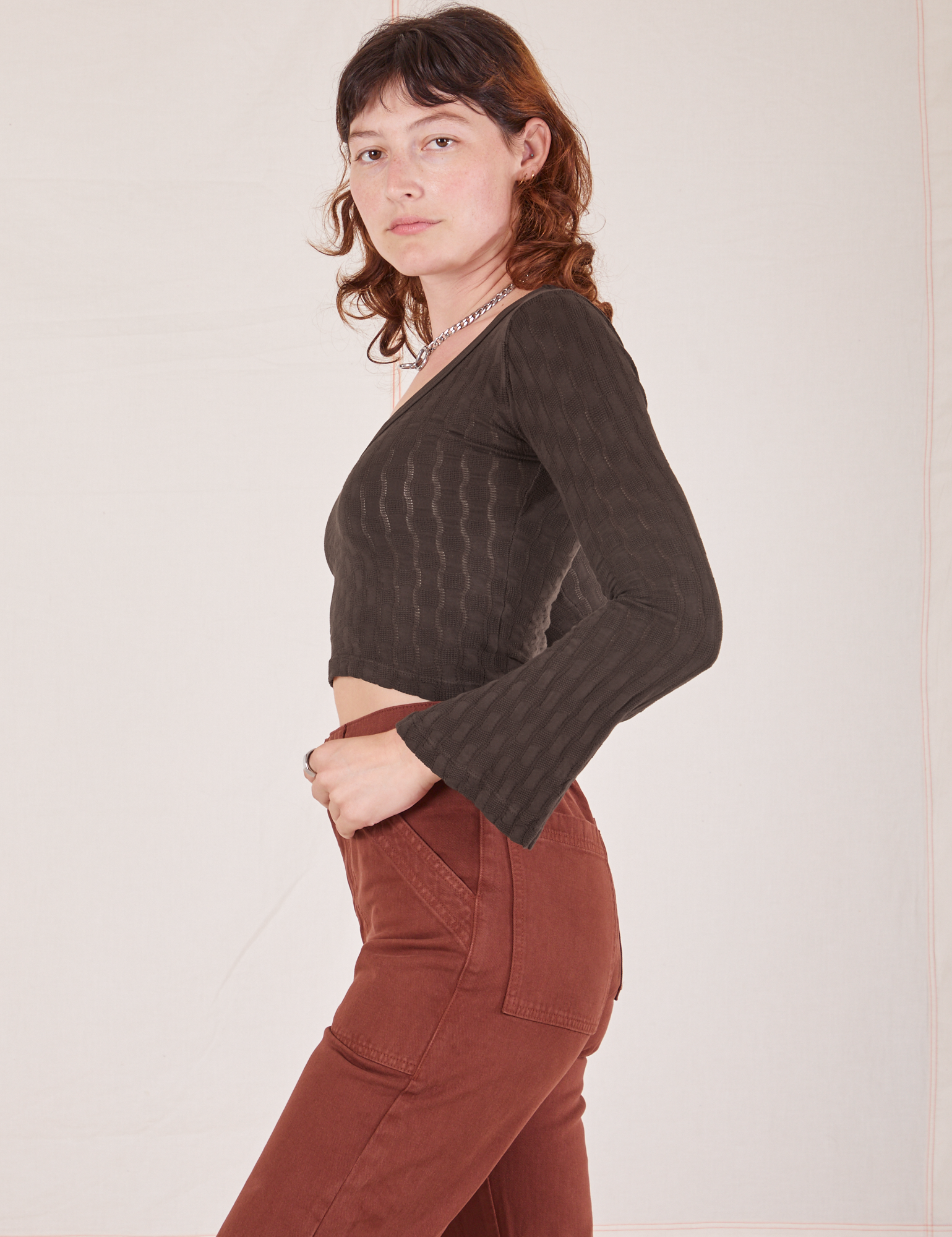 Side view of Bell Sleeve Top in Espresso Brown worn by Alex
