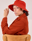 Tiara is wearing the Wide Brim Denim Bucket Hats in Mustang Red