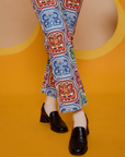 Butterfly Kaleidoscope Work Pants pant leg close up on Alex
