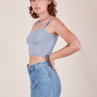 Side view of Cropped Cami in Periwinkle and light wash Frontier worn by Alex