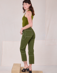 Angled back view of Railroad Carpenter Jeans in Summer Olive on Alex