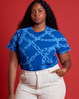 Meghna is wearing Chain Link Vintage Tee in Royal Blue tucked in vintage tee off-white Western Pants