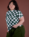 Angled front view of Checker Organic Tee in Swamp Green on Ashley