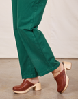 Side view pant leg close up of Short Sleeve Jumpsuit in Hunter Green on Tiara