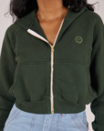 Close up of zipped Cropped Zip Hoodie in Swamp Green on Kandia