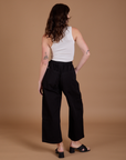 Drop Pocket Cargo Pants in Basic Black back view on Alex
