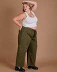 Side view of Drop Pocket Cargo Pants in Surplus Green and Cropped Tank in Vintage Tee White on Juliet