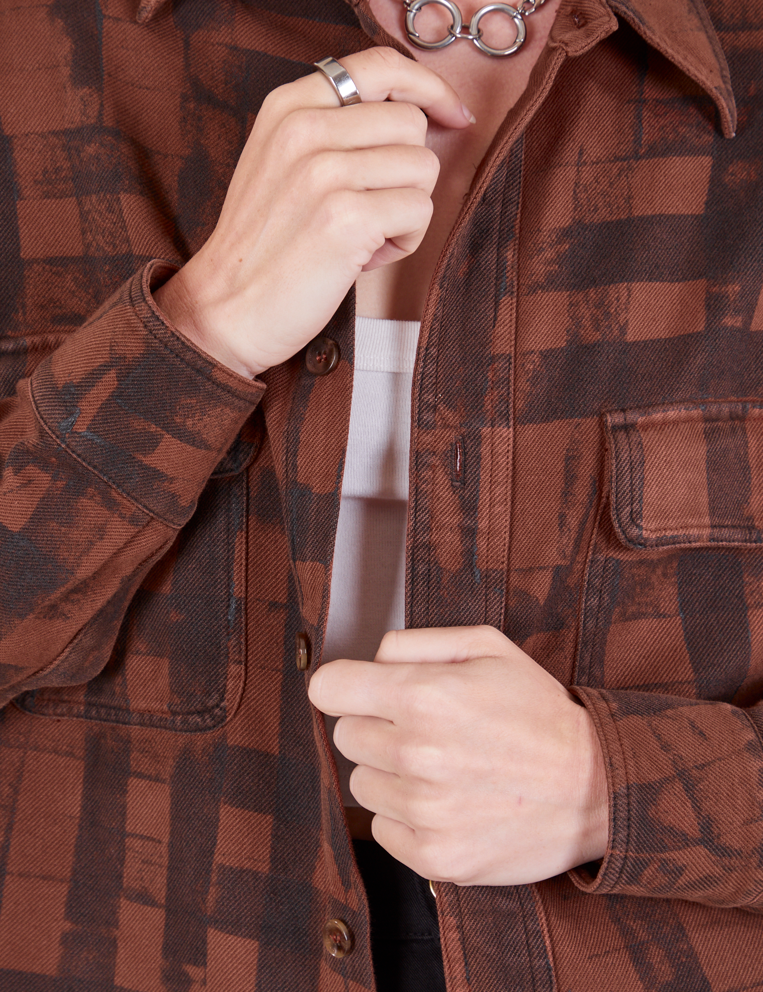 Plaid Flannel Overshirt in Fudgesicle Brown front close up on Alex