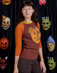 Raglan Tee in Jack-O-Lantern angled front view on Alex