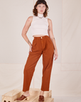 Alex is 5'8" and wearing XXS Heavyweight Trousers in Burnt Terracotta paired with vintage off-white Sleeveless Turtleneck