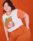 Anniversary Tee in Orange Blossom angled front view on Ashley