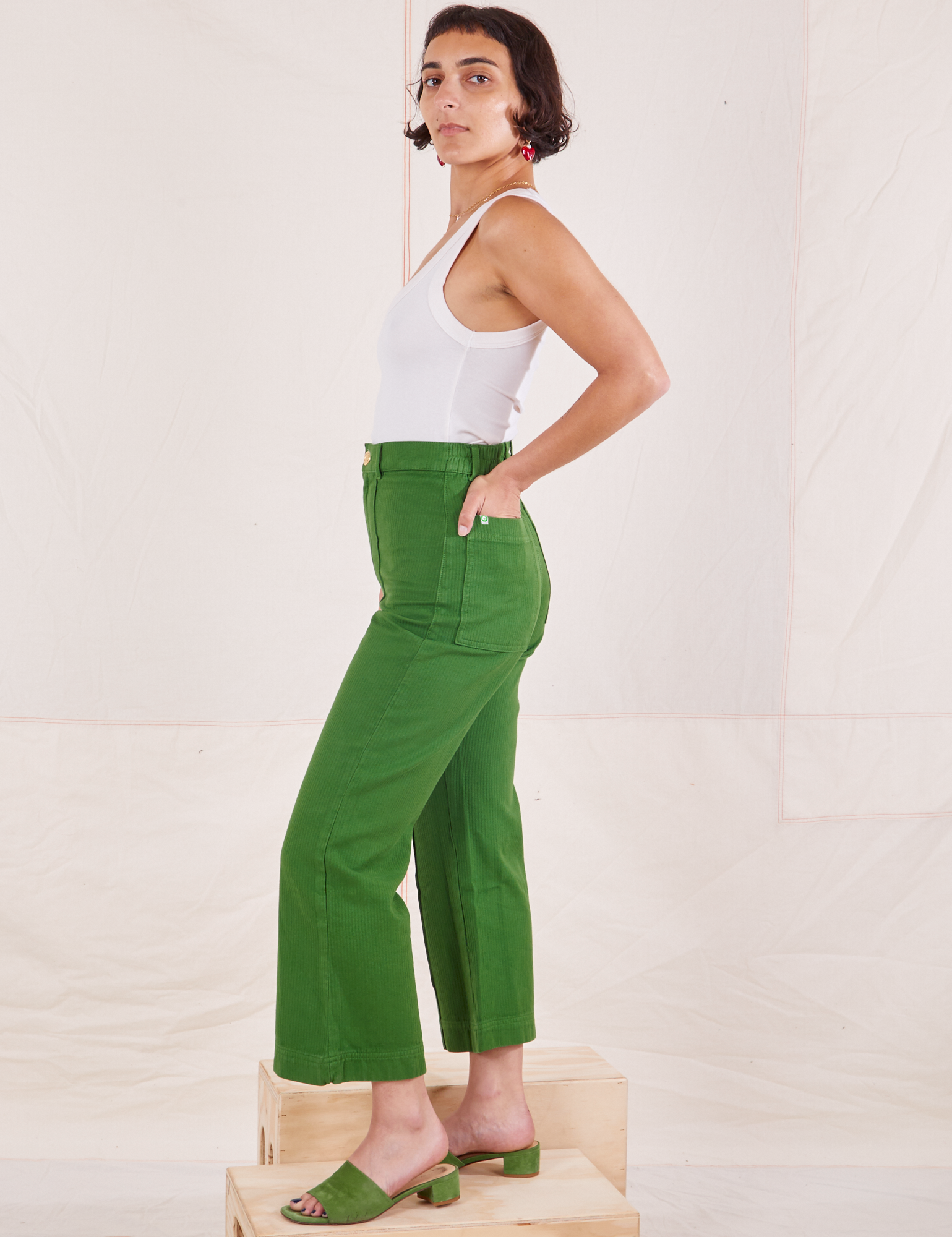 Side view of Heritage Westerns in Lawn Green and Cropped Tank Top in vintage tee off-white on Soraya