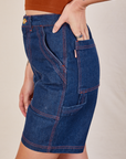 Side view of Carpenter Shorts in Dark Wash on Alex