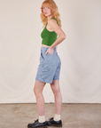 Side view of Carpenter Shorts in Light Wash and lawn green Cropped Tank on Margaret