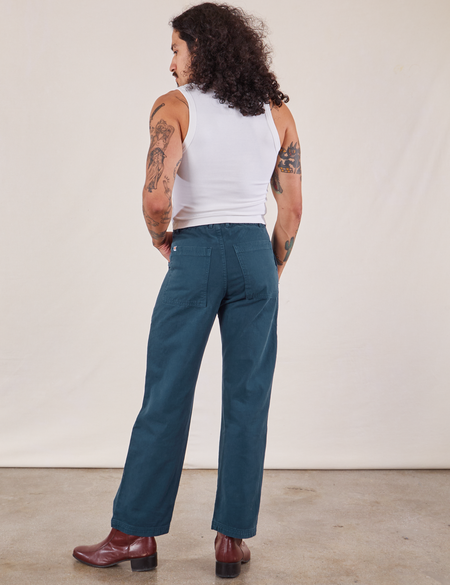 Back view of Work Pants in Lagoon and vintage tee off-white Cropped Tank