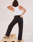 Back view of Organic Work Pants in Basic Black and Racerback Tank in vintage tee off-white on Tiara