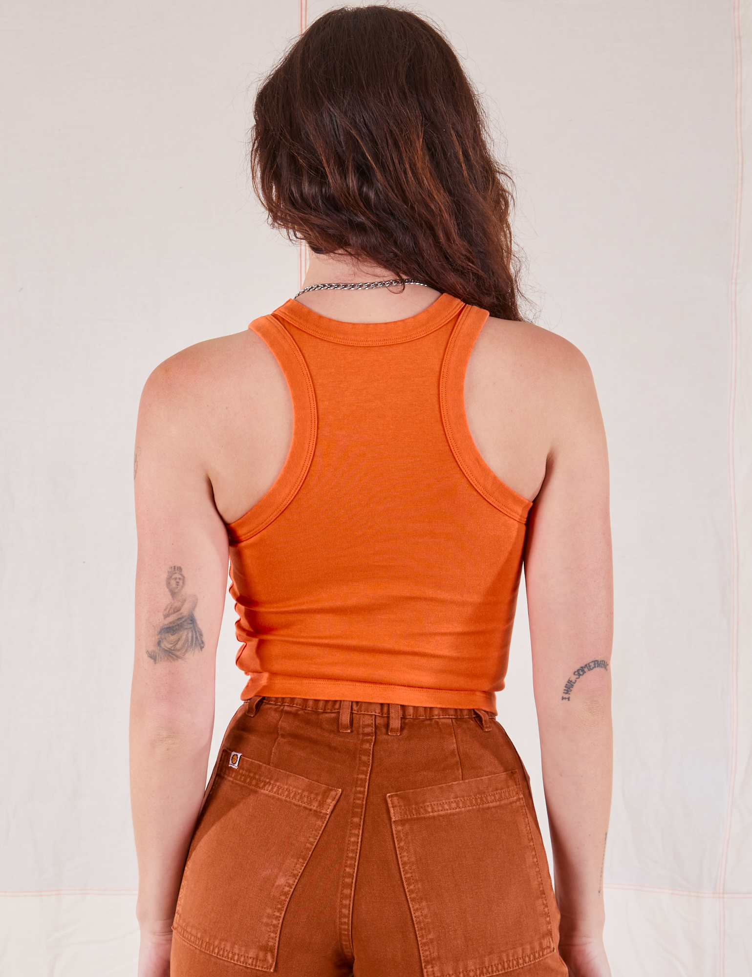 Racerback Tank in Sunset Orange back view on Alex