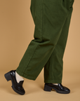 Baggy Mid-Rise Trousers in Evergreen side pant leg close up on Juliet