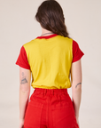 Back view of Mismatched Tee in Yellow & Red on Alex