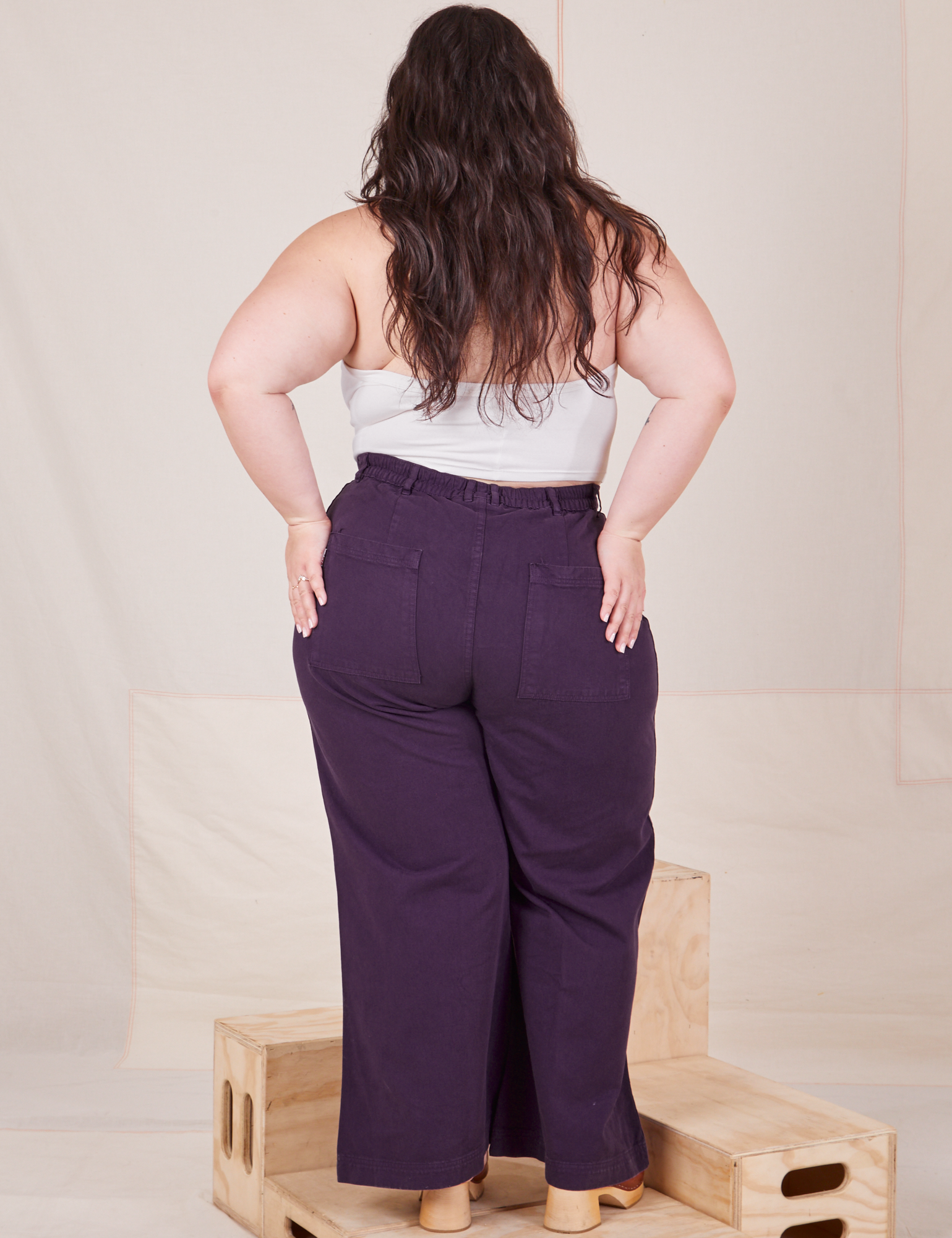 Back view of Bell Bottoms in Nebula Purple worn by Ashley