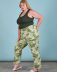 Side view of Work Pants in Ocean and Sky and swamp green Tank Top on Juliet