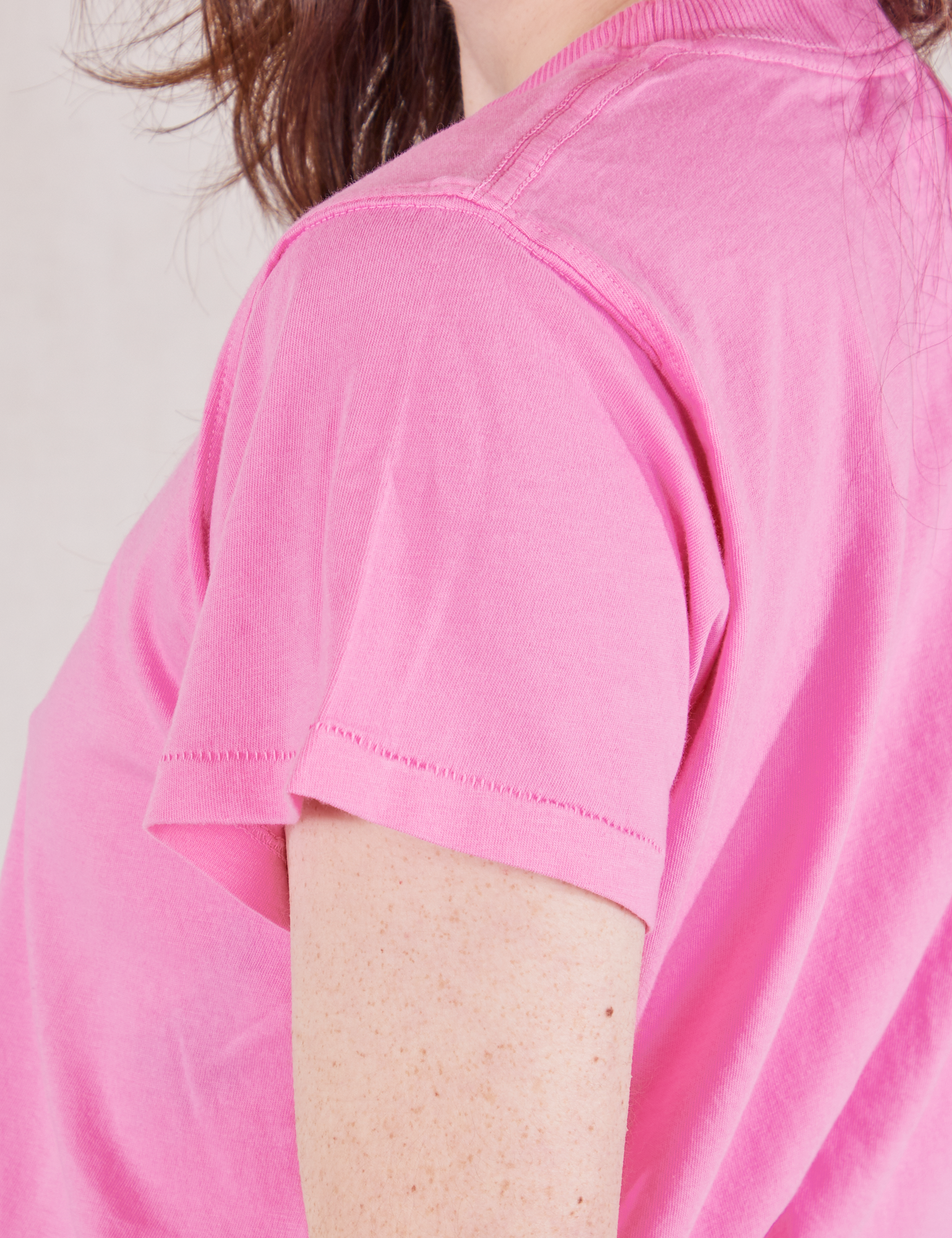Organic Vintage Tee in Bubblegum Pink sleeve close up on Hana
