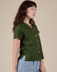 Pantry Button-Up in Evergreen angled front view on Alex