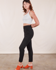 Side view of Pencil Pants in Basic Black and Halter Top in vintage tee off-white worn by Alex