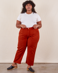 Morgan is 5'5" and wearing Petite 1XL Work Pants in Paprika paired with a Baby Tee in vintage tee off-white