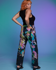 Angled back view of Work Pants in Rainbow Magic Waters and black Cropped Tank on Tiara