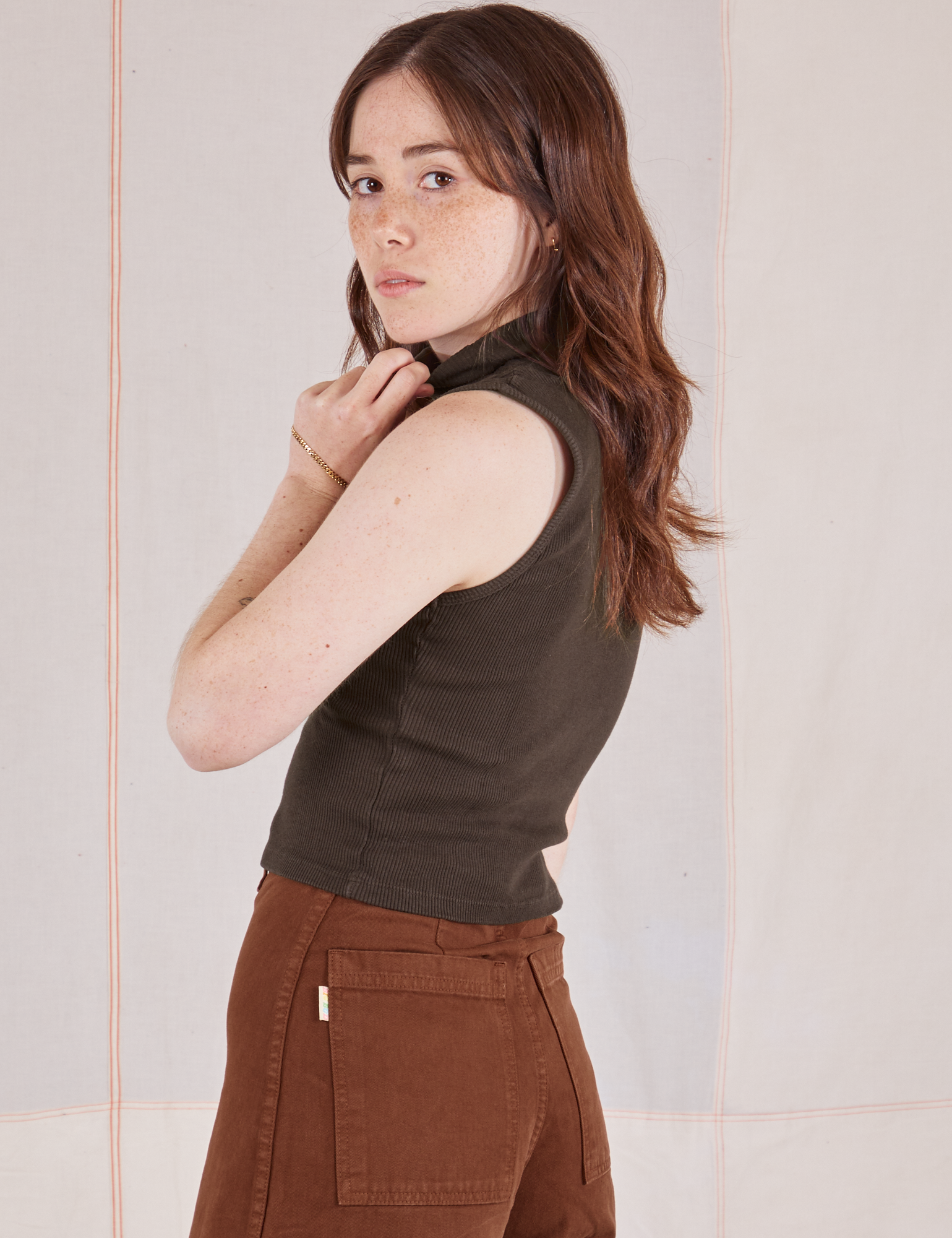 Side view of Sleeveless Essential Turtleneck in Espresso Brown on Hana