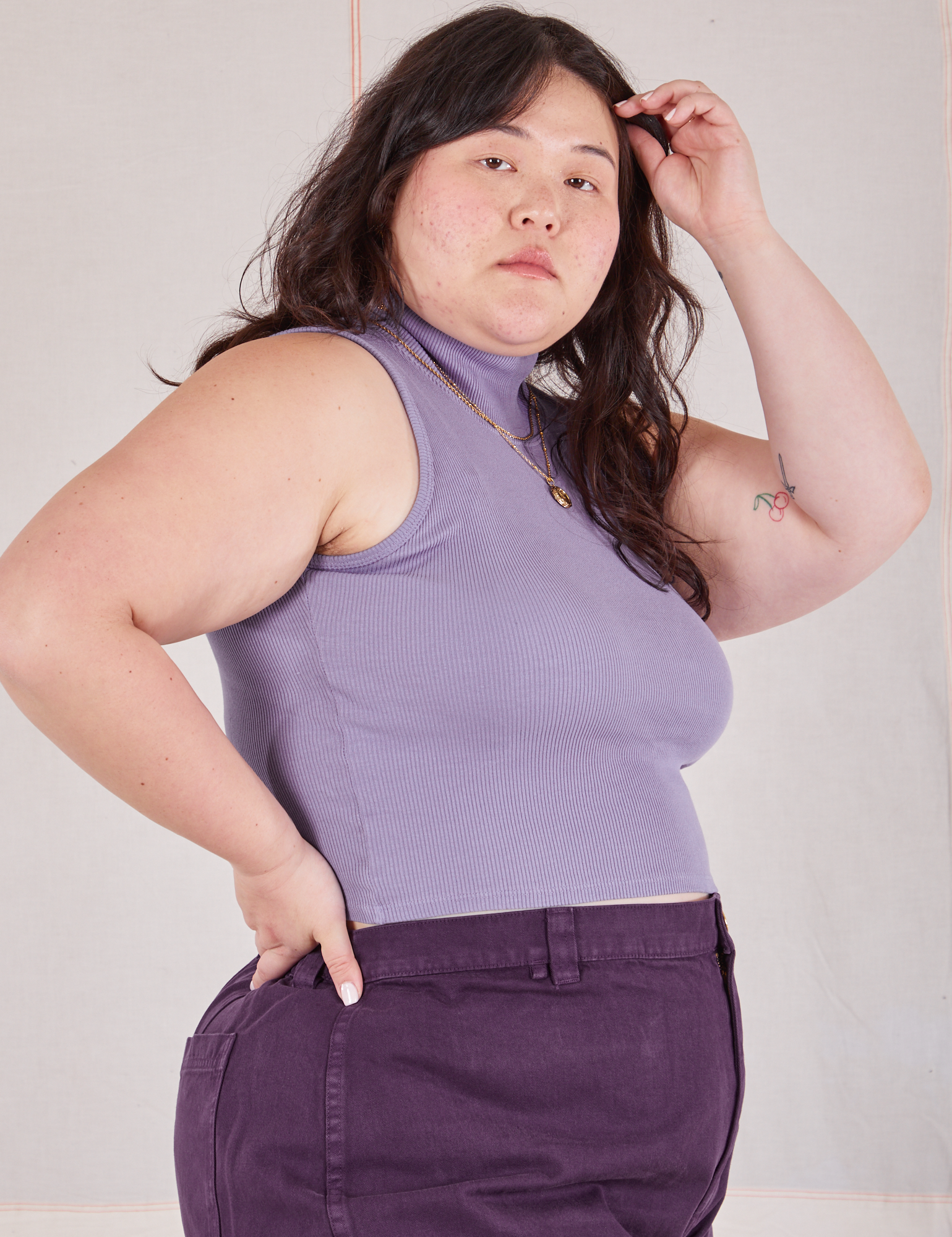 Side view of Sleeveless Essential Turtleneck in Faded Grape on Ashley