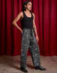 Angled front view of Drop Pocket Cargo Pants in Spider Webs and black Cropped Tank on Anthony