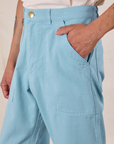 Side view close up of Anthony's hand in the pocket of Work Pants in Baby Blue