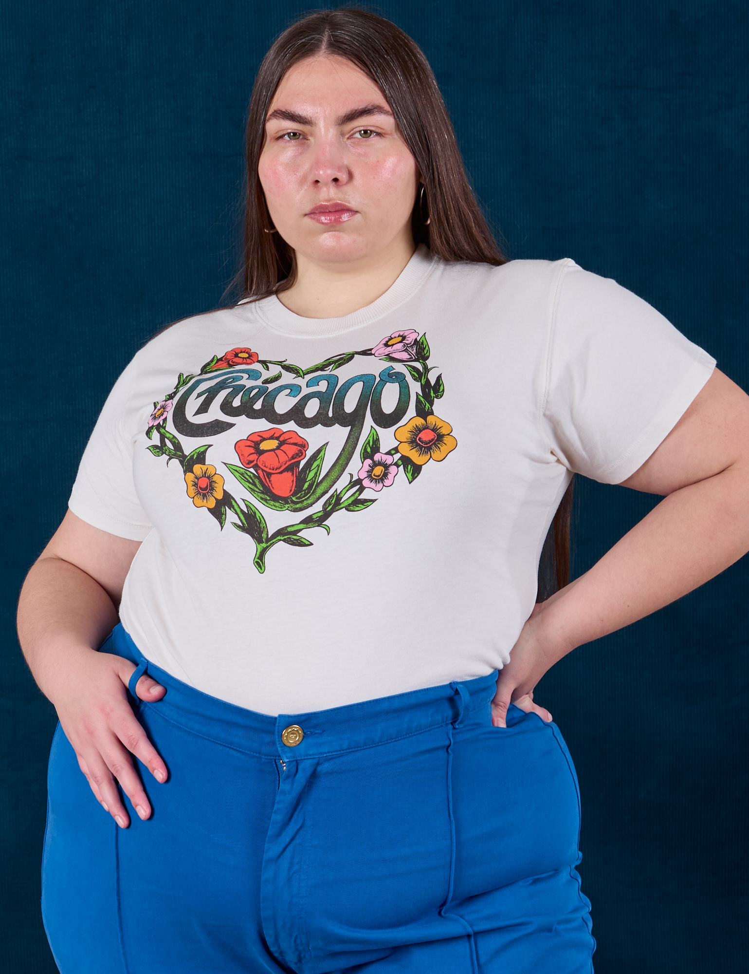 Chicago Tourist Tee tucked into royal blue Western Pants