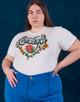 Chicago Tourist Tee tucked into royal blue Western Pants