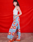 Side view of Wide Leg Denim Trousers in Painted Flowers and Cropped Tank in Vintage Tee Off-White