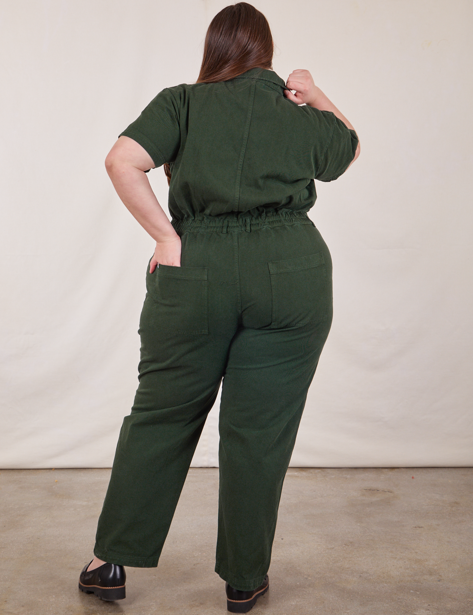 Short Sleeve Jumpsuit in Swamp Green back view on Marielena
