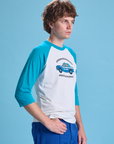 Taxi Raglan Tee in San Francisco angled front view on Quinn