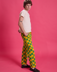 Side view of Checkerboard Work Pants in Green/Yellow and Organic Tee in Vintage Off-White