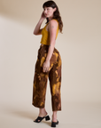 Angled back view of Magic Waters Drop Pocket Pants in Honey Brown on Alex