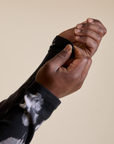 Close up of Long Sleeve Baby Tee in Ink Blot sleeves on Demi