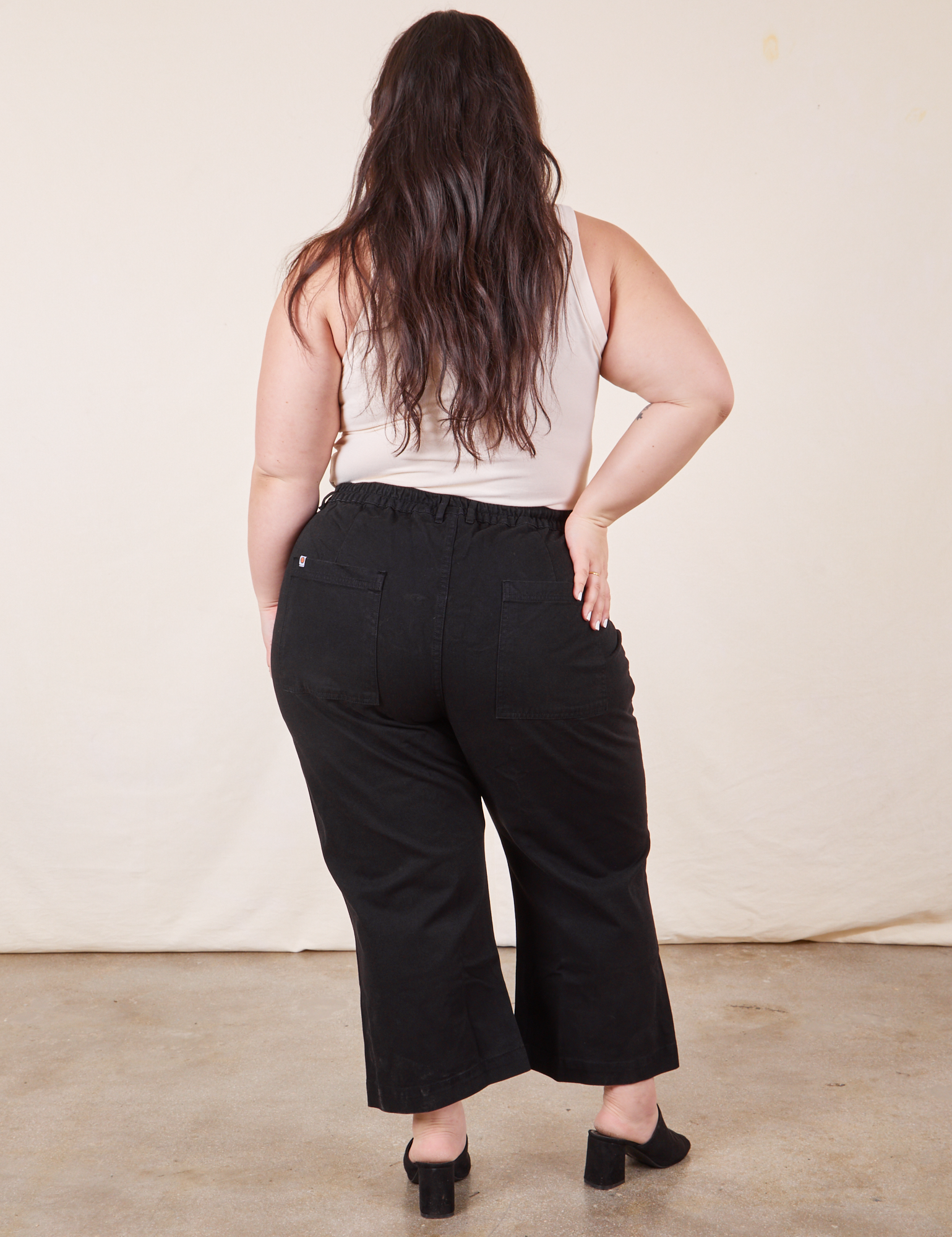 Western Pants in Basic Black back view on Ashley wearing vintage off-white Tank Top